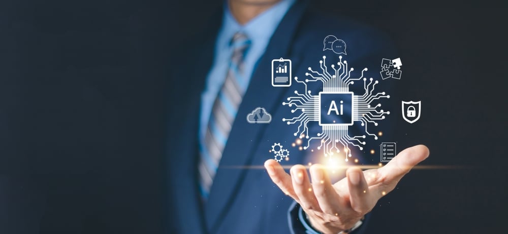 Image of a man’s hand with a floating representation of an AI technology network.