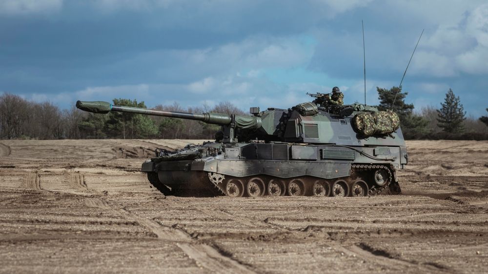 A tactical military vehicle navigating harsh off-road terrain, demonstrating a rugged deployment utilizing MIL-STD-810H certified computing.